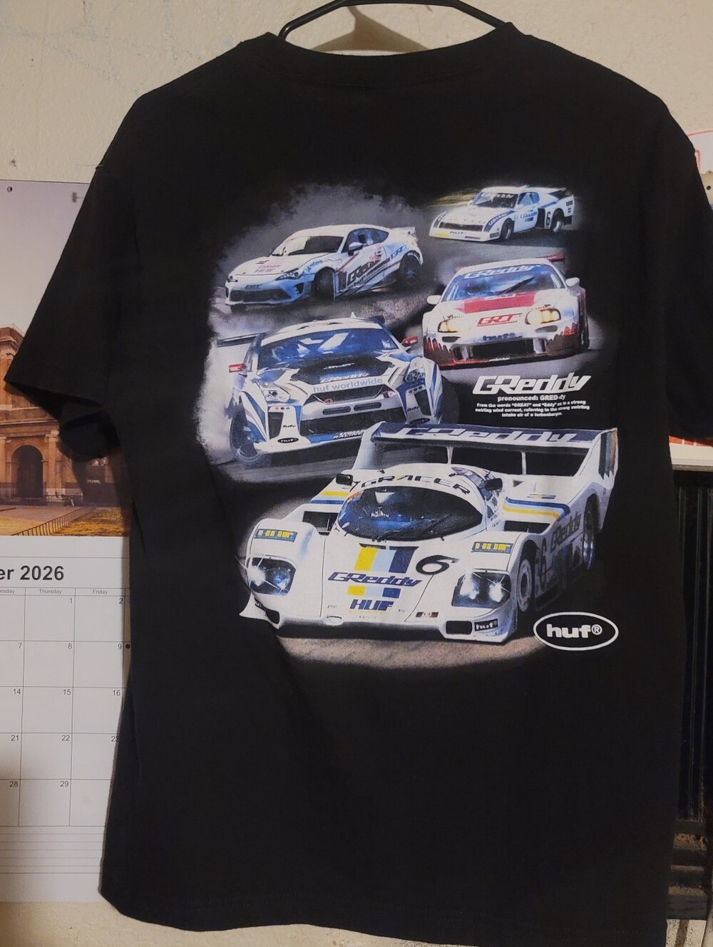 HUF Black Tee with White and Blue Racing Car Graphic
